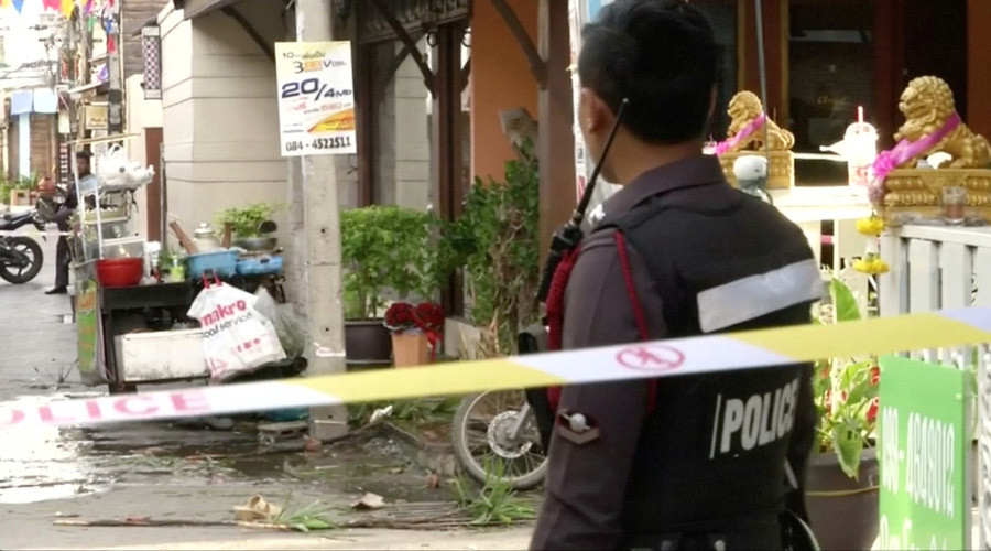 A policeman is seen at the site of one of two bomb blasts which occurred