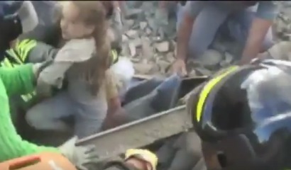 A screenshot of the moment the little girl was pulled out of the rubble