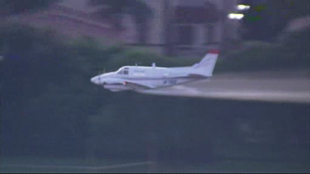 A small plane loaded with larvicide sprayed an area north of downtown Miami