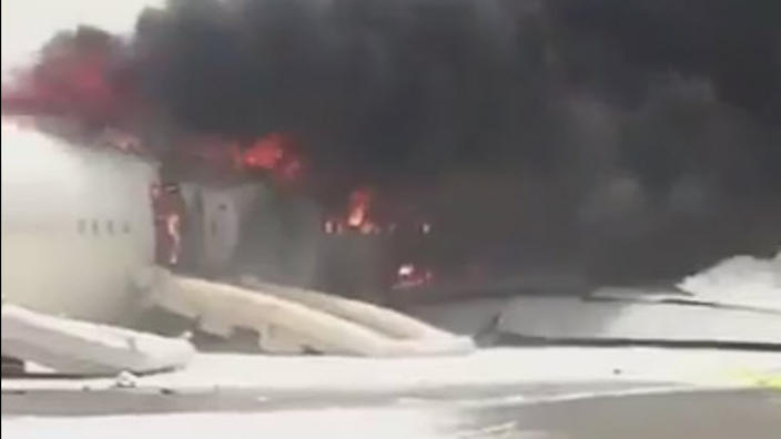 A still from video footage of an Emirates plane on fire at Dubai International Airport