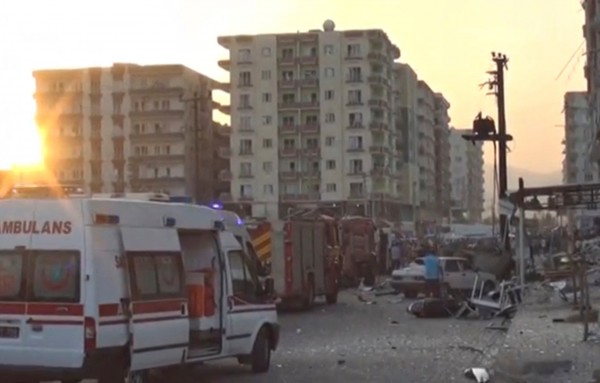 A still image taken from a video footage shows emergency vehicles at the scene of a bomb blast in Kiziltepe Turkey