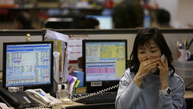 A stockbroker in Hong Kong. The Shenzhen trading link is the second with the mainland