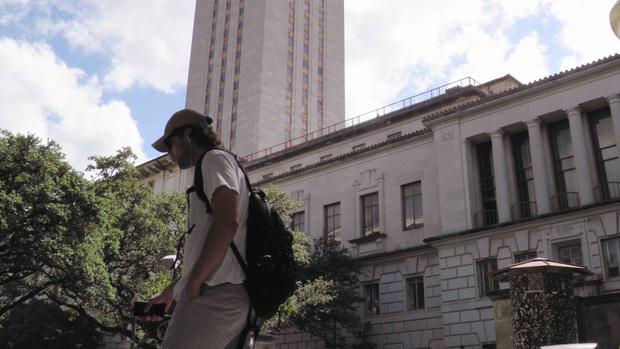 A student walks at the University of Texas campus in Austin Texas