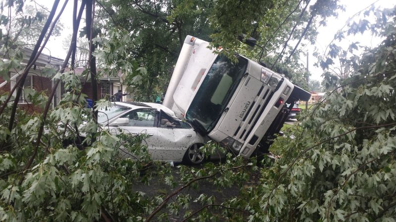 A vehicle rests on another after a tornado struck in Kokomo Ind. Wednesday