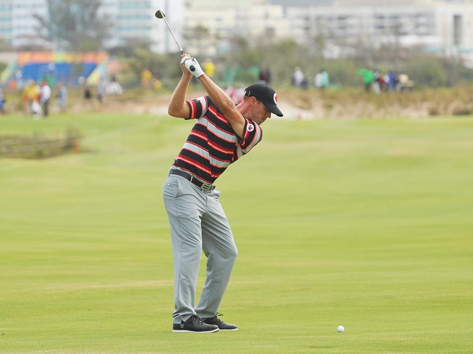 Graham Delaet of Canada hits his second shot on the 11th hole during the second round of the men's golf tournament at the Olympic Golf Course in Rio de Janeiro Brazil on Friday Aug. 12 2016