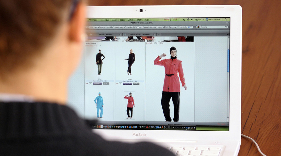 A woman surfs a website which sells'burqinis, a swimsuit that covers most of the body Metz eastern France