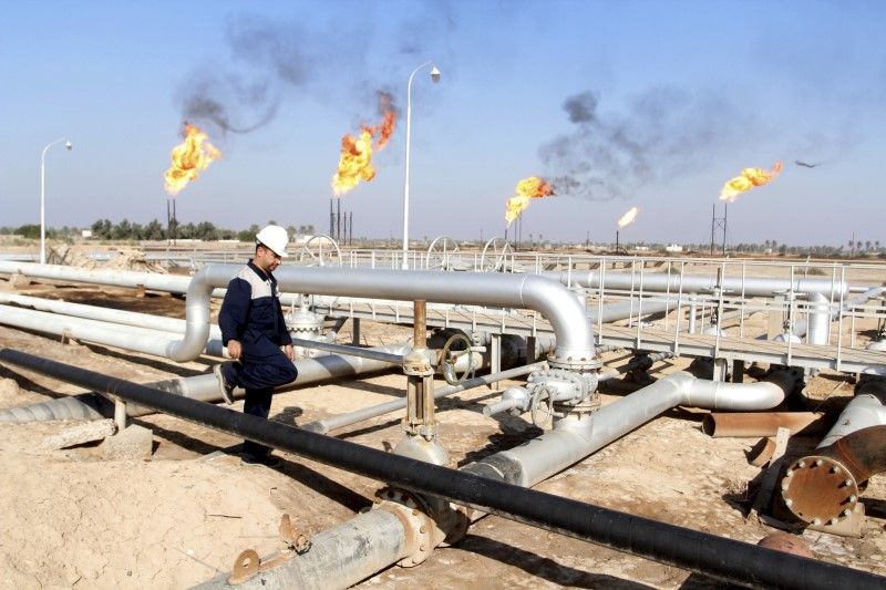 A worker walks at Nahr Bin Umar oil field north of Basra