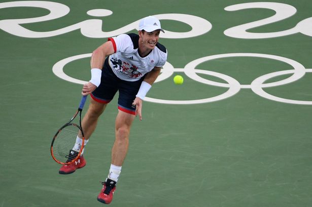 AFP  Getty

Andy Murray serves Viktor Troicki during their men's first round singles tennis match at the Olympic Tennis Centre