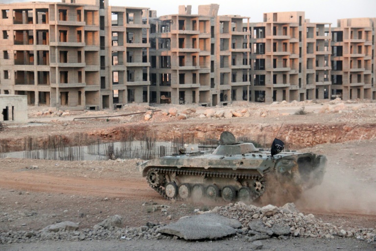 AFP  Omar haj kadour Opposition fighters drive a tank in a beseiged neighbourhood of Aleppo