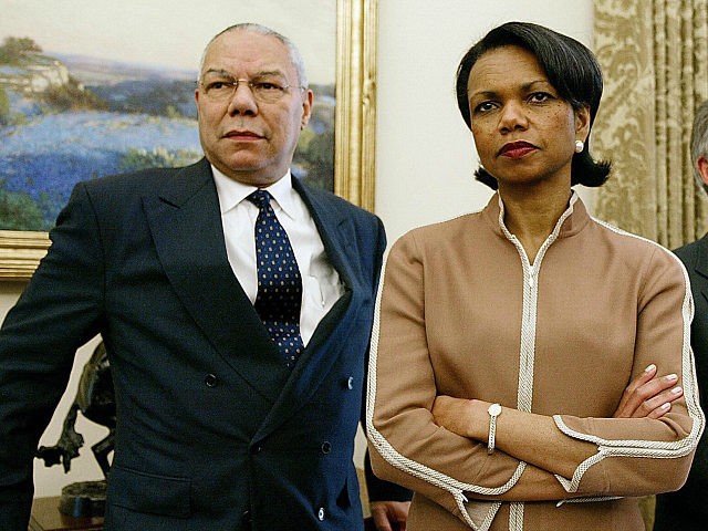 UNITED STATES Washington: US Secretary of State Colin Powell, National Security Advisor Condoleeza Rice and White House Chief of Staff Andrew Card look on as US President George W. Bush meets with Chilean President Ricardo Lagos in the Oval