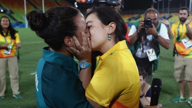 Brazilian sevens player Isadora Cerullo left and partner Marjorie Enya celebrate their engagement