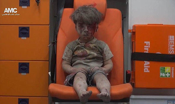 Omran Daqneesh sitting in the ambulance