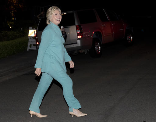 Democratic presidential nominee Hillary Clinton walks to greet people on the street as she leaves a fundraiser in Piedmont Calif. Tuesday Aug. 23 2016