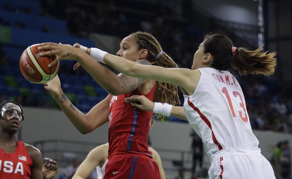 United States center Brittney Griner pulls down a rebound in front of China center Mengran Sun during the second half of a women's basketball game at the Youth Center at the 2016 Summer Olympics in Rio de Janeiro Brazil Sunday Aug. 14 2016. (AP P