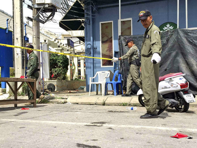 Investigators work at the scene of an explosion in the resort town of Hua Hin 240 kilometers south of Bangkok Thailand Friday Aug. 12 2016. The blast followed a series of two explosions in Hua Hin Thursday evening that left one person dead