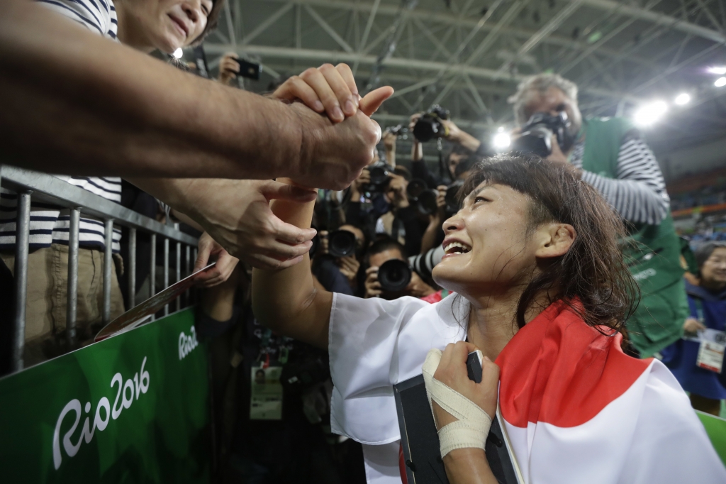 Japan's Kaori Icho celebrates winning gold against Russia's Valeria Koblova in the women's wrestling freestyle 58-kg competition at the the 2016 Summer Olympics in Rio de Janeiro Brazil Wednesday Aug. 17 2016. (AP