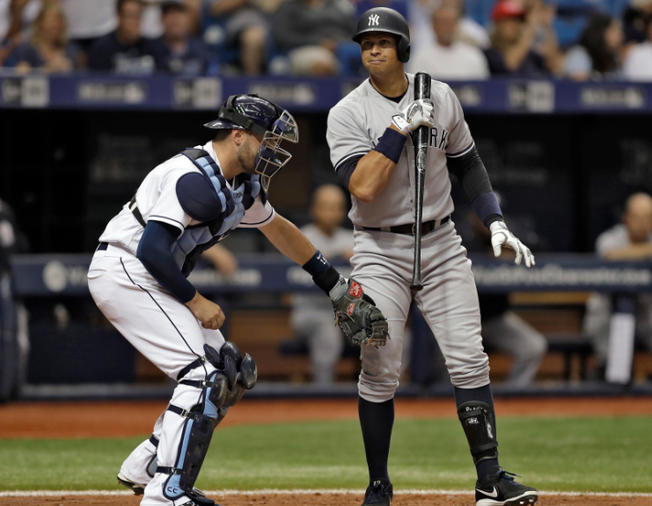 APRays catcher Curt Casali tags Alex Rodriguez after he struck out swinging against Drew Smyly during the fourth inning