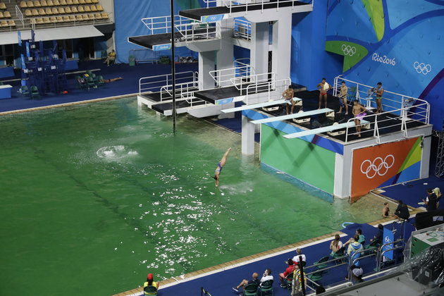 ASSOCIATED PRESS
The water of the diving pool appears a murky green