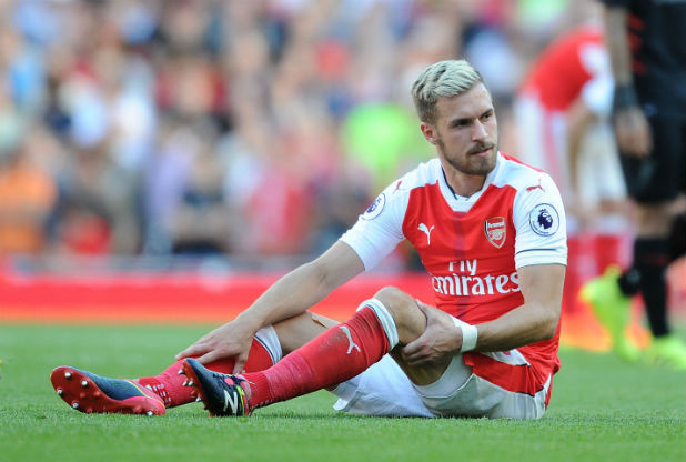 Aaron Ramsey goes down injured against Liverpool