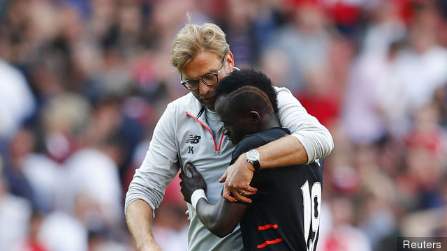 Liverpool manager Juergen Klopp celebrates with Sadio Mane after the match