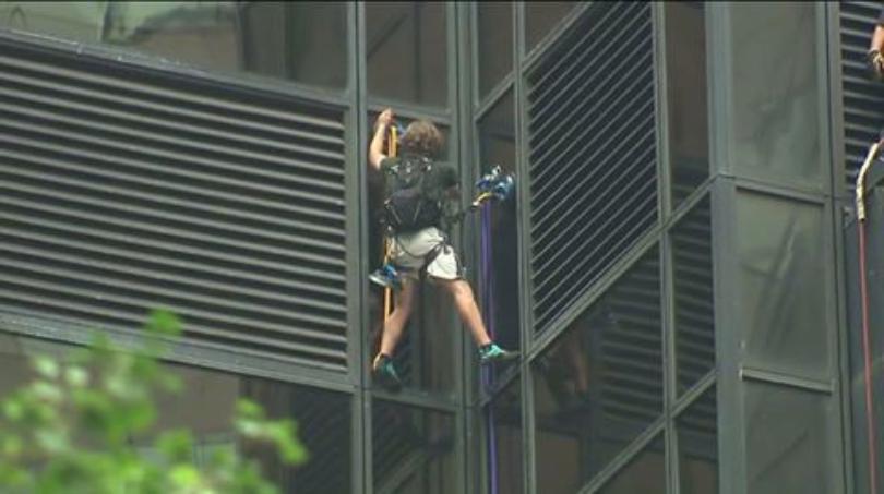 Man is trying to scale Trump Tower in NYC using suction cups