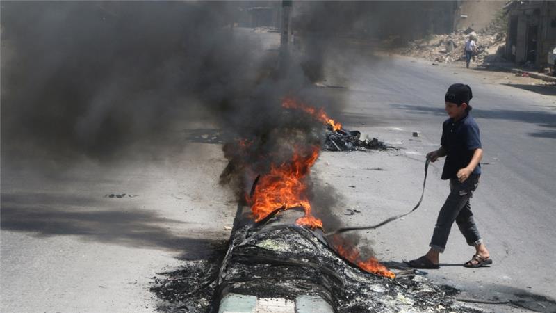 Activists have set tyres ablaze in Aleppo to prevent air strikes from hitting their targets