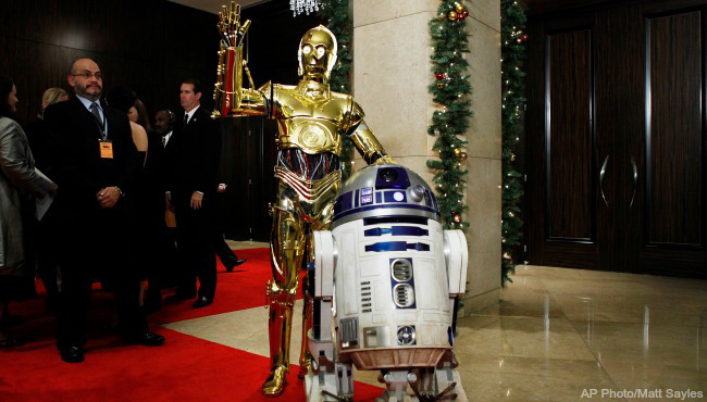 “Star Wars” characters C-3PO left and R2D2 arrive at the American Cinematheque Award gala honoring Samuel L. Jackson in Beverly Hills Calif. (AP