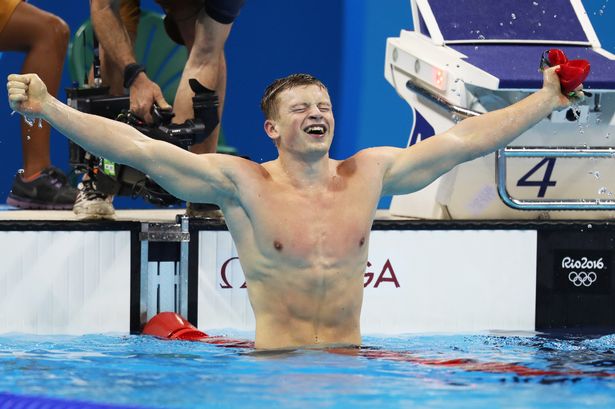 Adam Peaty celebrates winning the men's 100m breaststroke during day two of the Rio 2016 Olympic Games