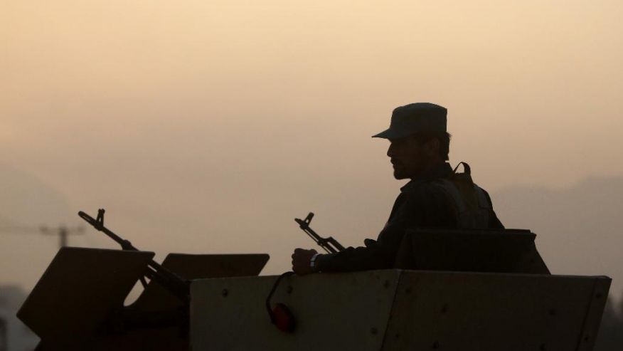 An Afghan policeman guards on a road leading to the site of an explosion in Kabul Afghanistan Monday Aug. 1 2016. A strong explosion took place early Monday near a guesthouse for foreigners in Kabul an Afghan police official said. (AP