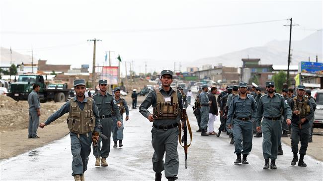 Afghan policemen run near the site of a bomb attack that targeted a convoy of buses transporting police cadets on the outskirts of Kabul Afghanistan