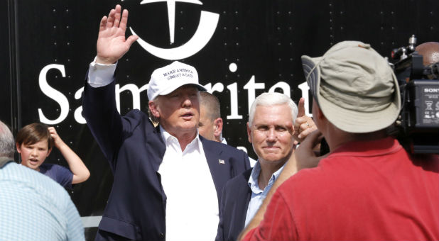 Republican presidential nominee Donald Trump and Republican U.S. vice presidential candidate Mike Pence speak with flood victims outside Greenwell Springs Baptist Church in Central Louisiana