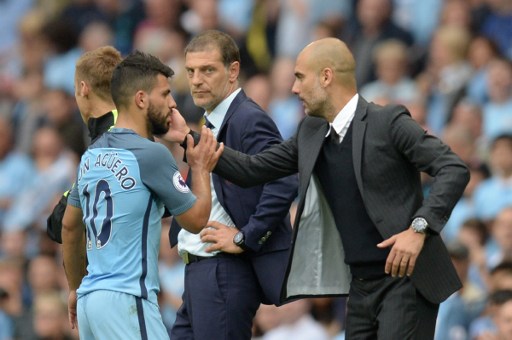 Manchester City's Spanish manager Pep Guardiola greets Manchester City's Argentinian striker Sergio Aguero after he was substituted during the English Premier League football match between Manchester City and West Ham United at the Etihad St