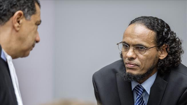 Ahmad al-Mahdi right appears at the International Criminal Court in the Hague Netherlands on Monday