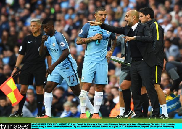 Aleks Kolarov gets instructions from Guardiola