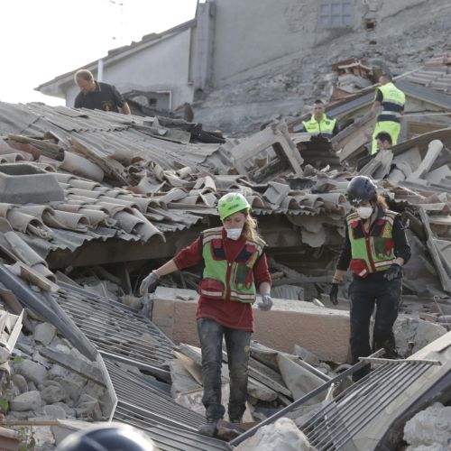 Alessandra Tarantino  AP						Rescuers search for earthquake survivors under the rubble in Amatrice in central Italy