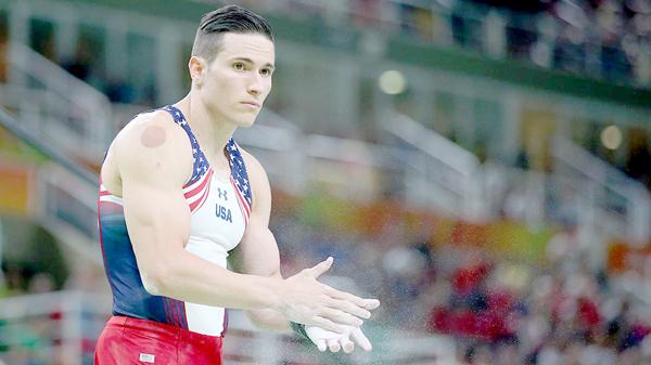 Alex Naddour of the US gymnastics team sports his cupping marks in undated