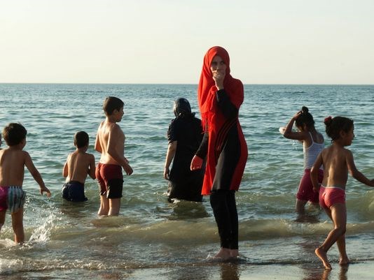 Algerians gathering on a public beach reserved for families in the capital Algiers