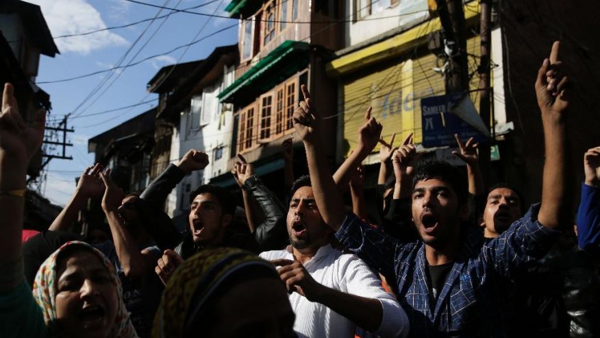 Kashmiri people shout pro freedom slogans during a protest march in Srinagar Indian controlled Kashmir Friday Aug. 26 2016. Curfew and protests have continued across the valley amidst outrage over the killing of a top rebel leader by Indian troops