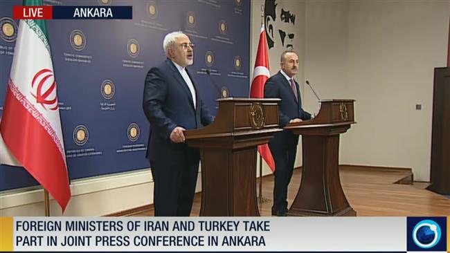 Iranian Foreign Minister Mohammad Javad Zarif gives a joint press conference with his Turkish counterpart Mevlut Cavusoglu in the Turkish capital Ankara