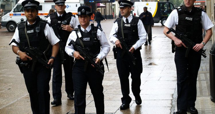 British armed police patrol London's Leicester Square in July 2005 following the suicide bombings on the London transport system. The