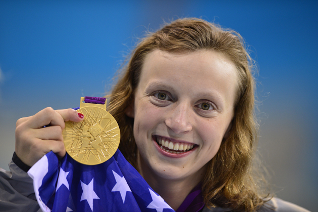 US swimmer Katie Ledecky poses on the podium after winning gold in the women's 800m freestyle final during the swimming event at the London 2012 Olympic Games