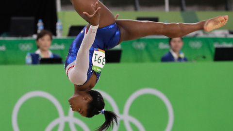 Bronze medalist Russia's Aliya Mustafina left gold medalist United States&#039 Simone Biles center and silver medalist United States&#039 Aly Raisman show off their medals for the artistic gymnastics women's individual all-around final