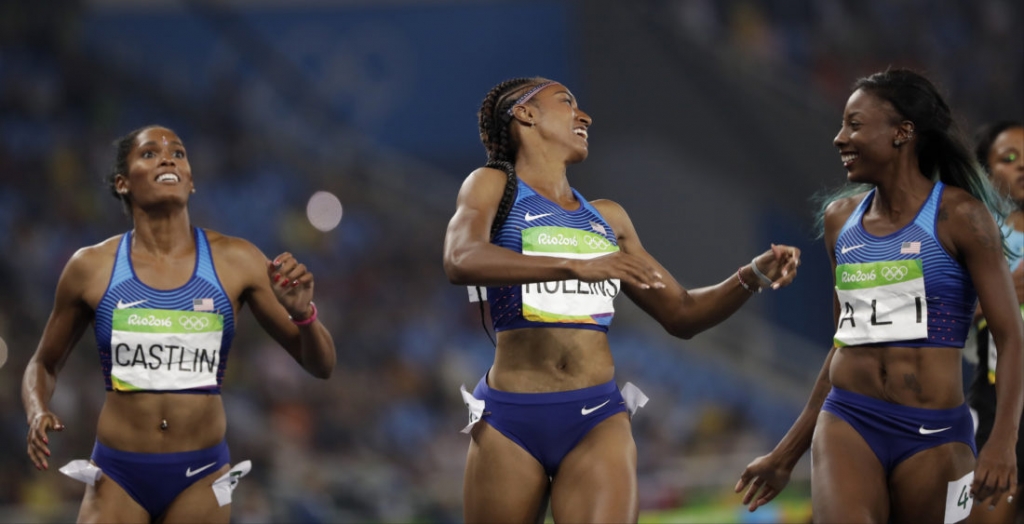 Brianna Rollins from the United States center celebrates winning the gold medal in the women's 100-meter hurdles final ahead of second placed United States&#039 Nia Ali right and third placed United States&#039 Kristi Castlin during the athleti