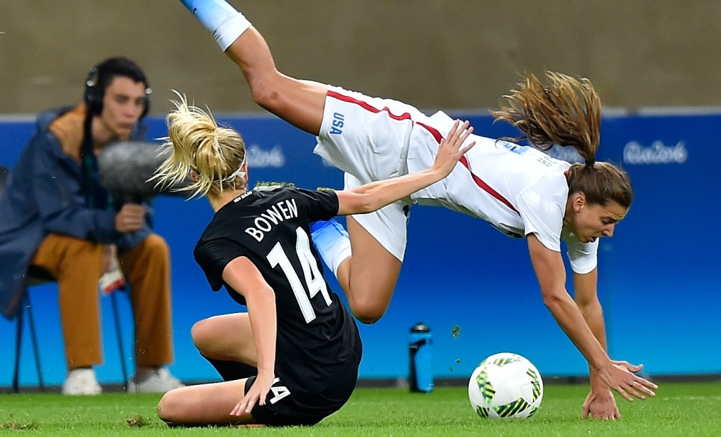 New Zealand’s Katie Bowen left collides with the United States’ Tobin Heath during the Olympics Group G match at Mineirao Stadium on Aug. 3 2016 in Belo Horizonte Brazil