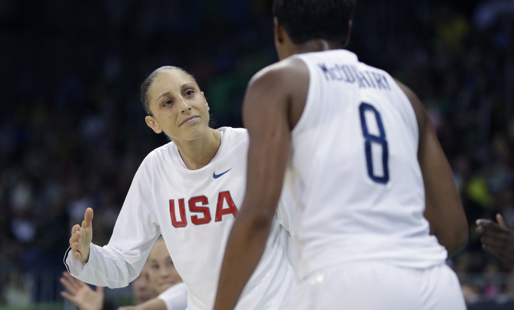 United States guard Diana Taurasi greets teammate Angel Mc Coughtry after a play during the second half of a women's basketball game against Senegal at the Youth Center at the 2016 Summer Olympics in Rio de Janeiro Brazil Sunday Aug. 7 2016. The U