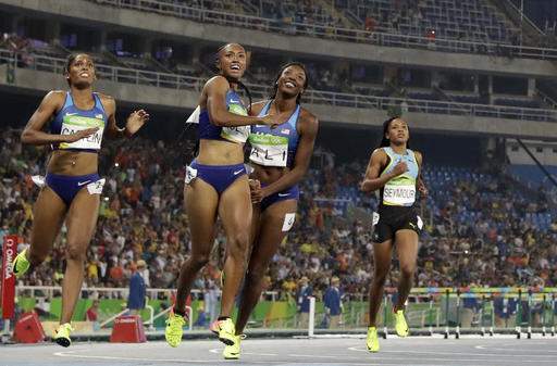 Miami's Rollins wins gold, leads USA sweep in 100 hurdles