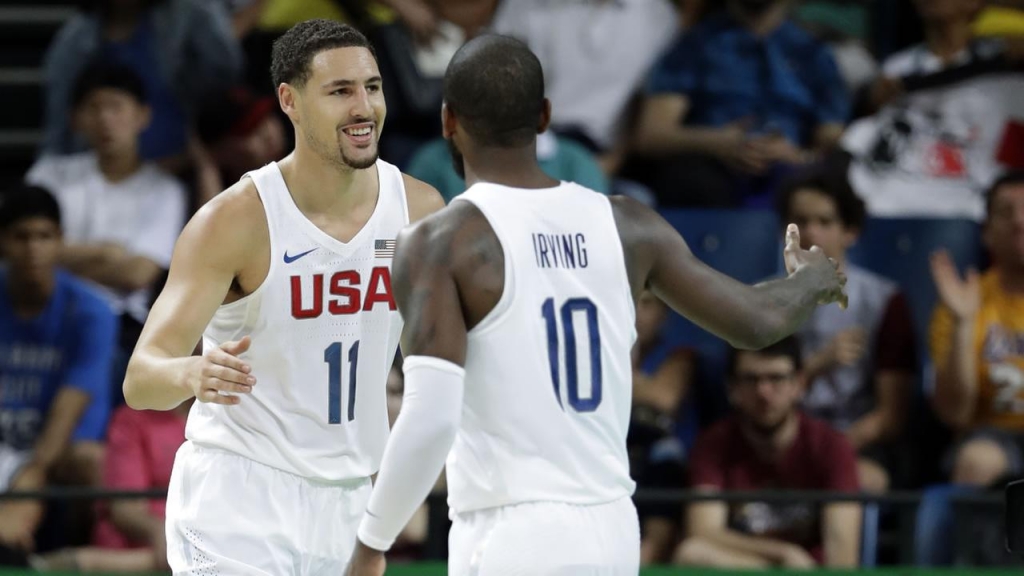 United States Klay Thompson celebrates with teammate Kyrie Irving after making a basket during a basketball game against France at the 2016 Summer Olympics in Rio de Janeiro Brazil Sunday Aug. 14 2016