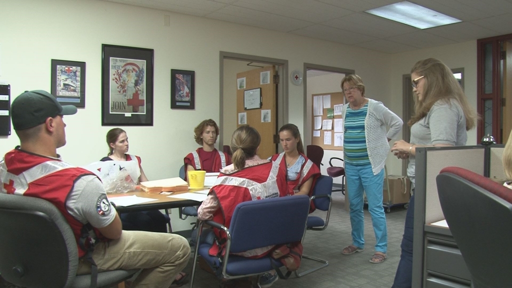 Americorp volunteers with the Red Cross receive advice before heading out to Baton Rouge