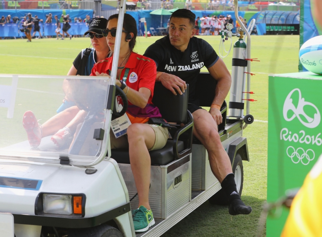 An injured Sonny Bill Williams is stretchered off during New Zealand's loss to Japan