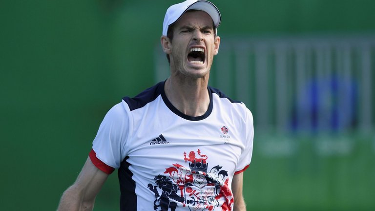 Andy Murray celebrates after finally seeing off Steve Johnson to book a semi-final spot at Rio 2016